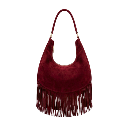 Zaza Bag es Confeccionada artesanalmente en León, Guanajuato, 100% piel con textura de gamuza y un diseño de flecos que aporta dinamismo y elegancia bohemia. Su diseño espacioso incluye compartimentos internos para un orden impecable y una correa perfecta para llevar al hombro con total comodidad.

Especificaciones del producto:

Material exterior: 100% piel vacuna (acabado en gamuza)

Detalles: Flecos frontales de piel y herrajes metálicos

Interior: Amplio compartimento principal con bolsillos internos de